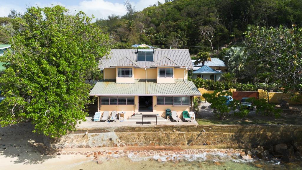 an aerial view of a house on the beach at Bonnen Kare in Grand Anse