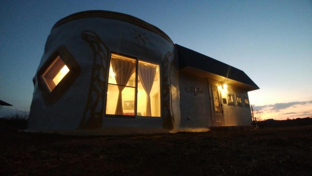 a dome house with the lights on in a field at Umidori - Vacation STAY 41944v in Hongō