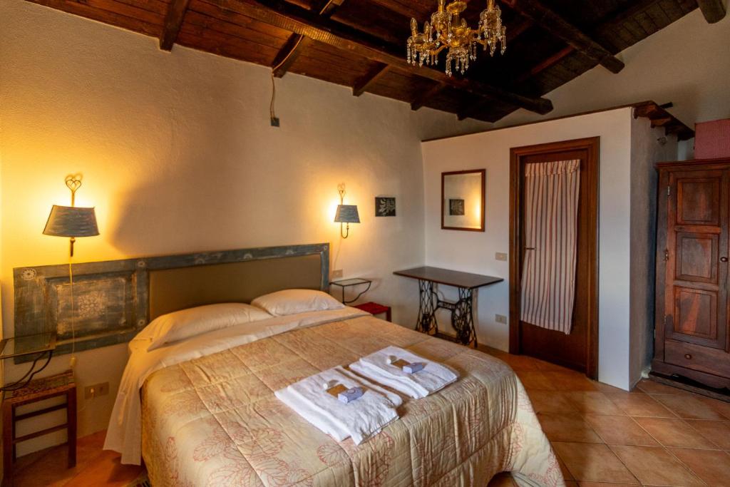 Postel nebo postele na pokoji v ubytování La Taberna di Rocca Calascio