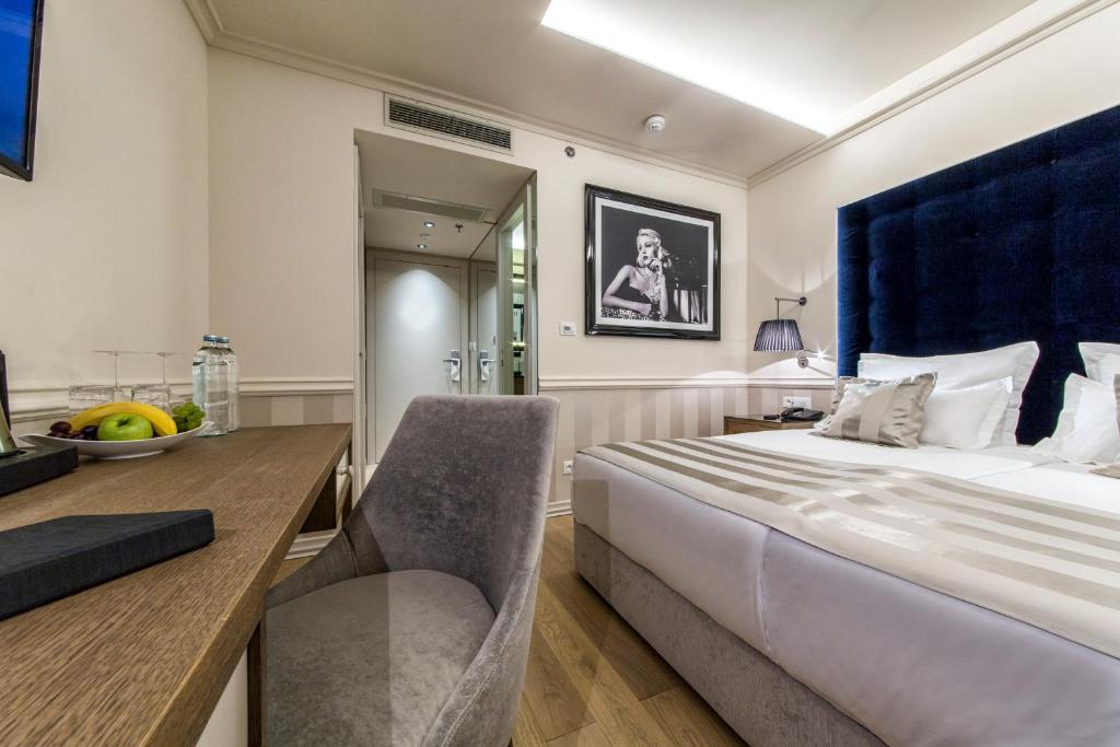 Posteľ alebo postele v izbe v ubytovaní Grand Hotel Slavia - Adults only