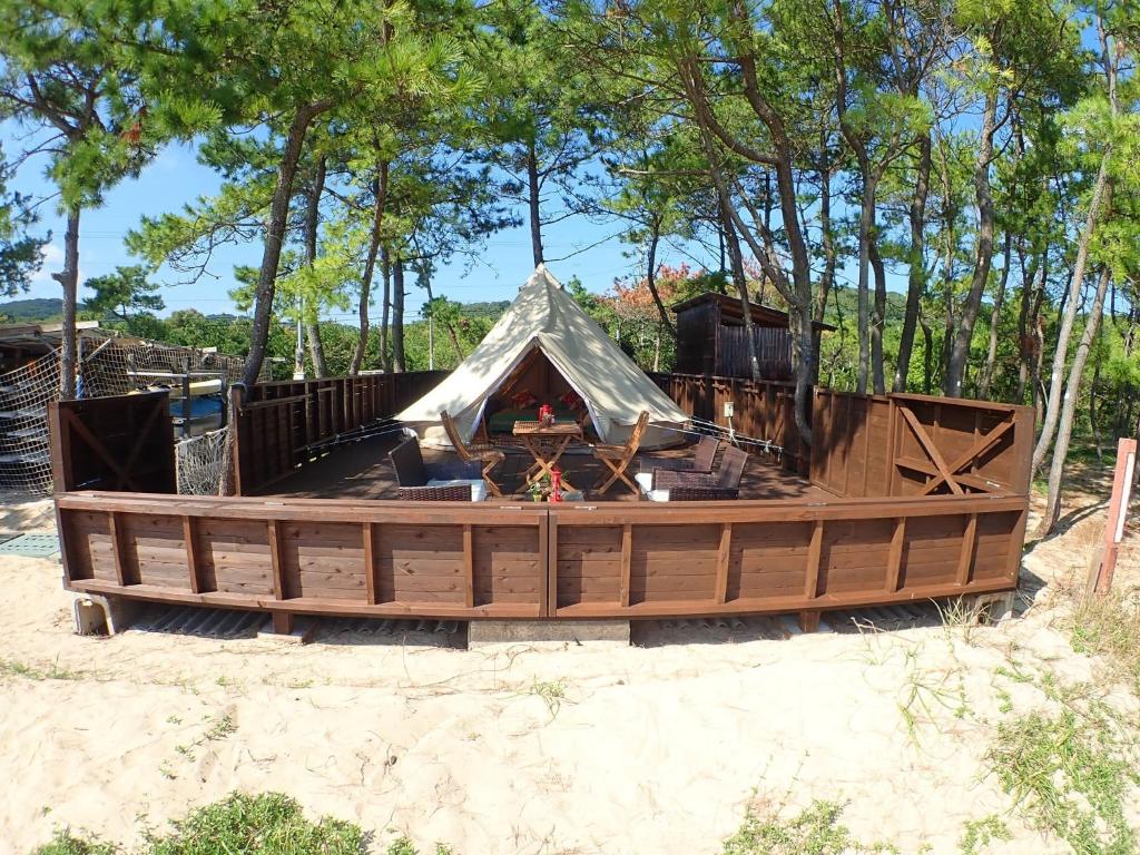 a tent in a wooden boat in the sand at Grand Beach - Vacation STAY 23980v in Iki