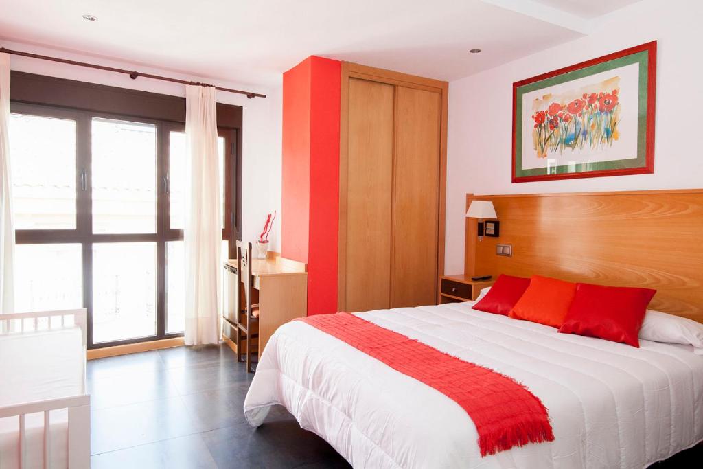 Postel nebo postele na pokoji v ubytování Hotel Real de Illescas