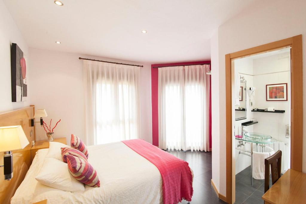 Postel nebo postele na pokoji v ubytování Hotel Real de Illescas