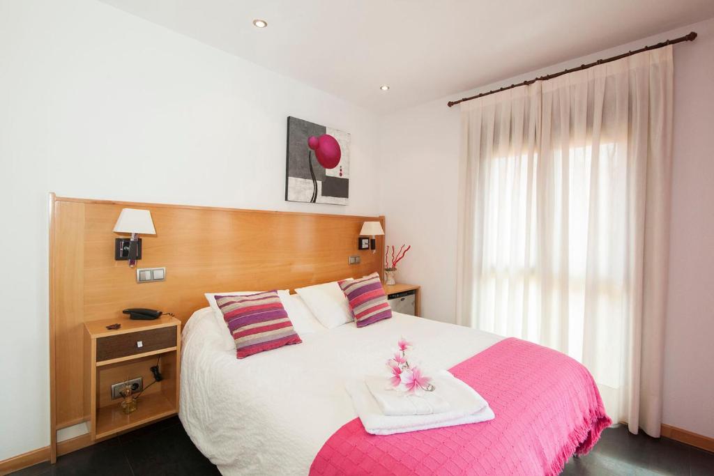 Postel nebo postele na pokoji v ubytování Hotel Real de Illescas