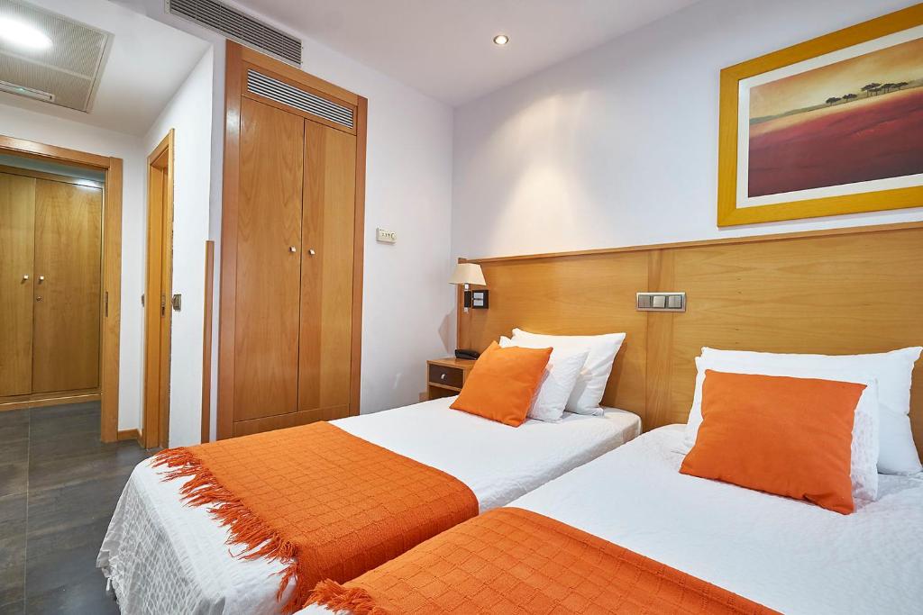 Postel nebo postele na pokoji v ubytování Hotel Real de Illescas