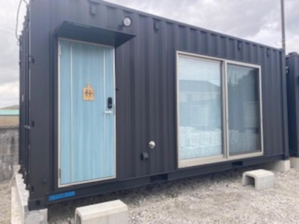 a black shipping container with two windows at Ko-eda Village - Camp - Vacation STAY 42084v in Iioka