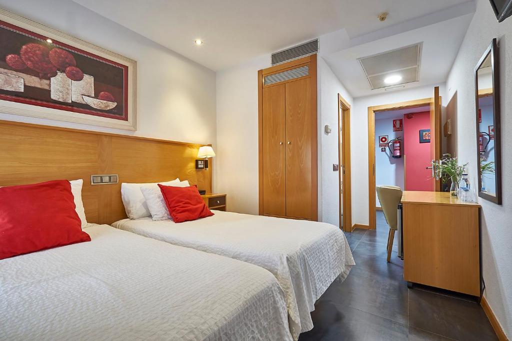 Postel nebo postele na pokoji v ubytování Hotel Real de Illescas