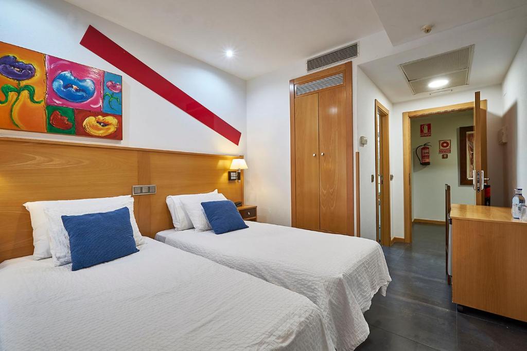 Postel nebo postele na pokoji v ubytování Hotel Real de Illescas