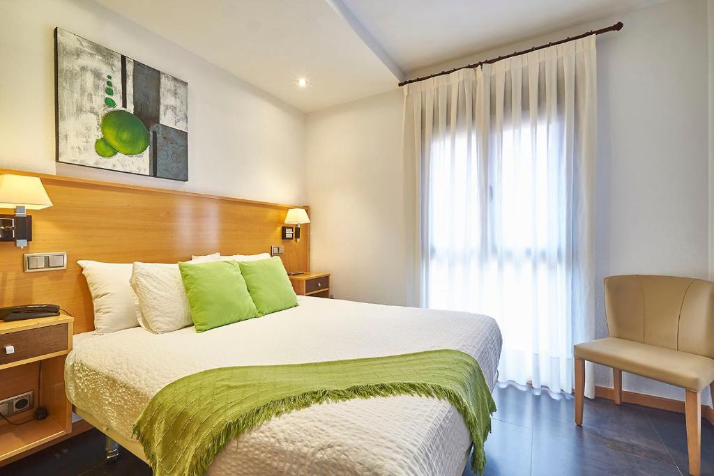 Postel nebo postele na pokoji v ubytování Hotel Real de Illescas