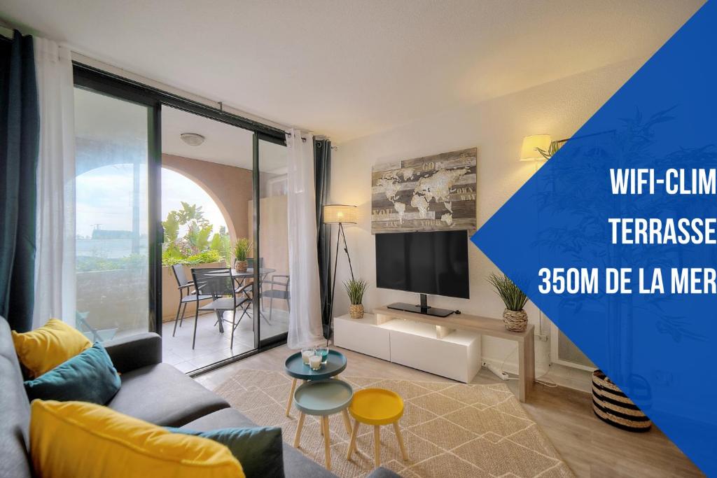 a living room with a couch and a tv at Tim - 2min de la mer - Piscine - Terrasse - VCA in Cannes