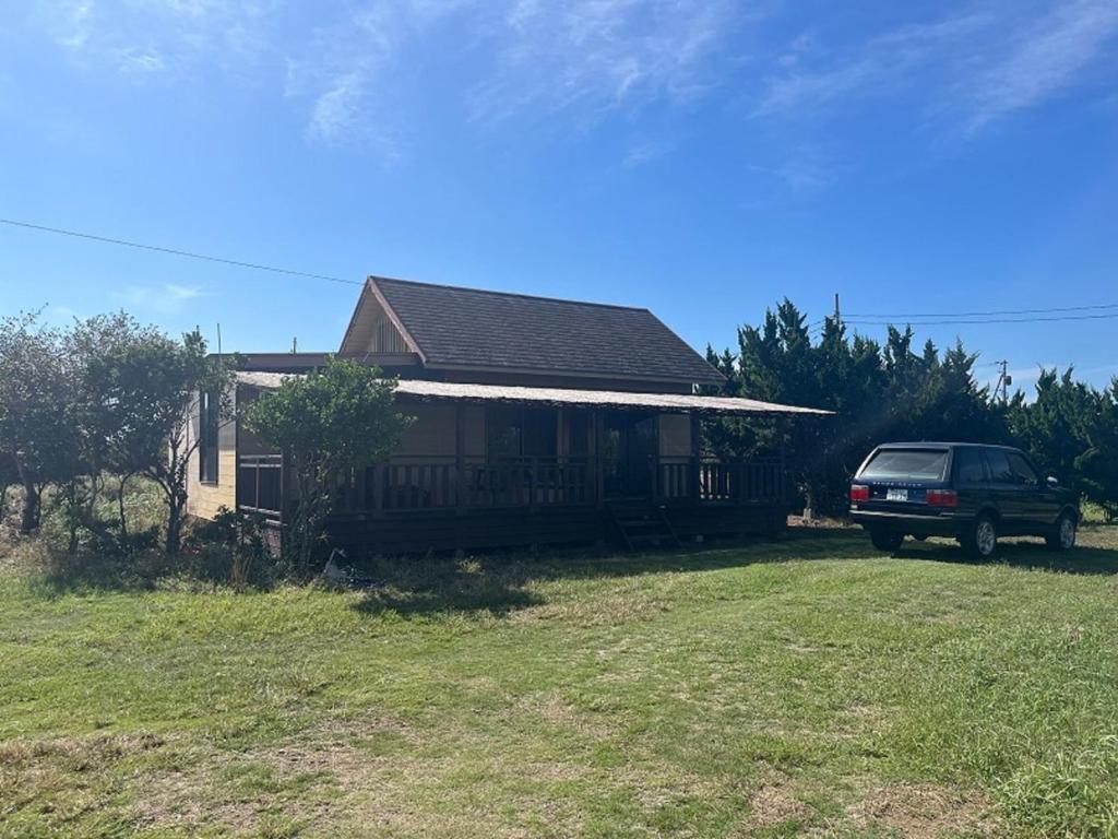 a house with a truck parked in front of it at Hasaki Seaside Campsite - Vacation STAY 51110v in Shari