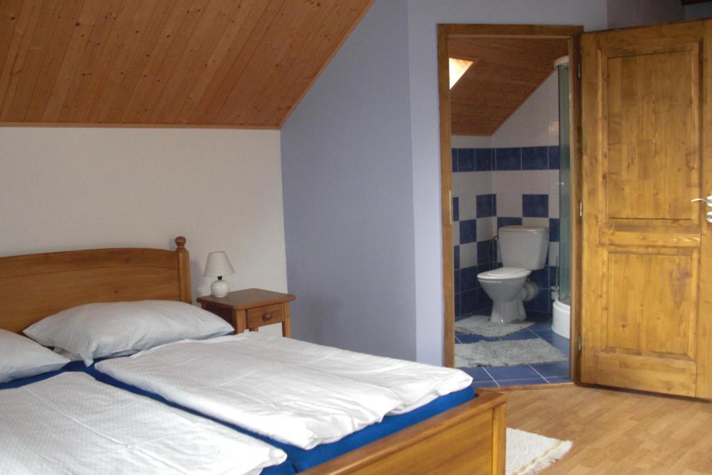 Postel nebo postele na pokoji v ubytování Pension Lažany