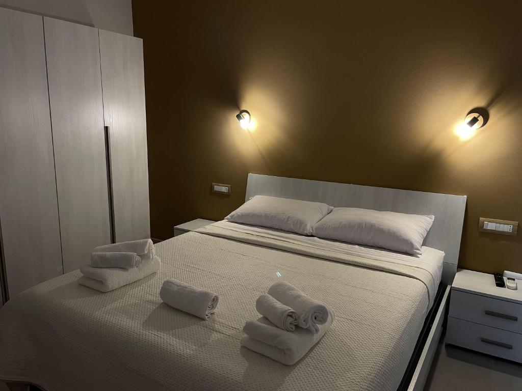 Postel nebo postele na pokoji v ubytování Le Ghie