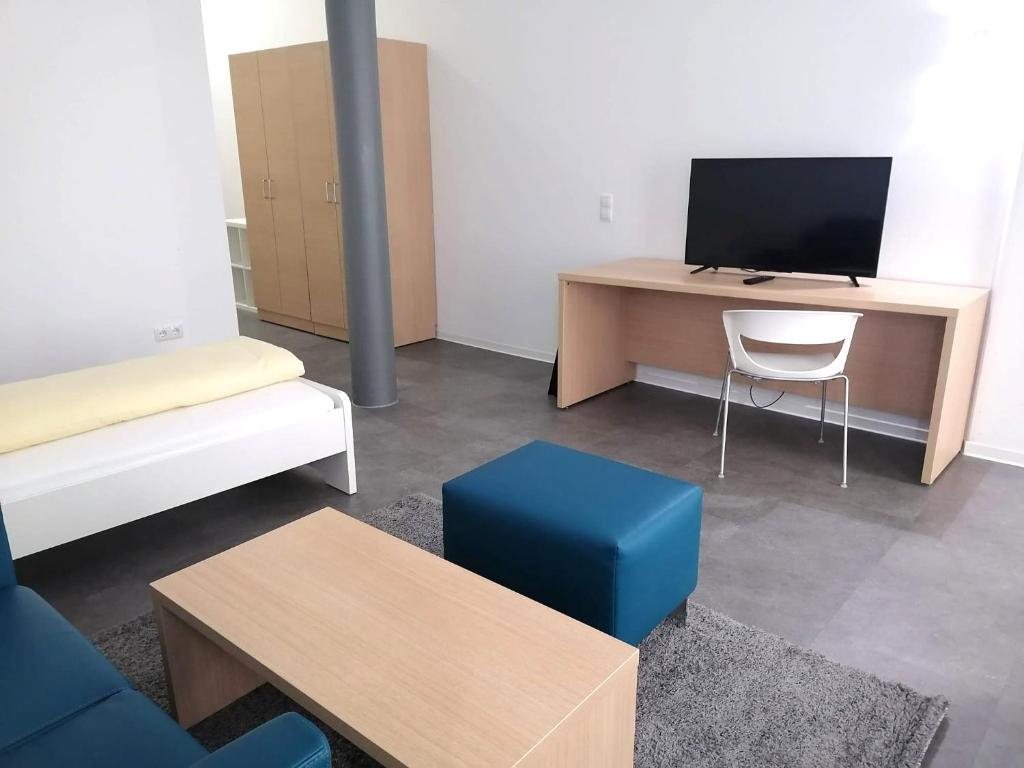 TV a/nebo společenská místnost v ubytování Fabella Flats Forchheim