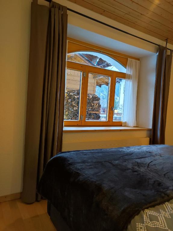Postel nebo postele na pokoji v ubytování Appartement in St. Niklaus
