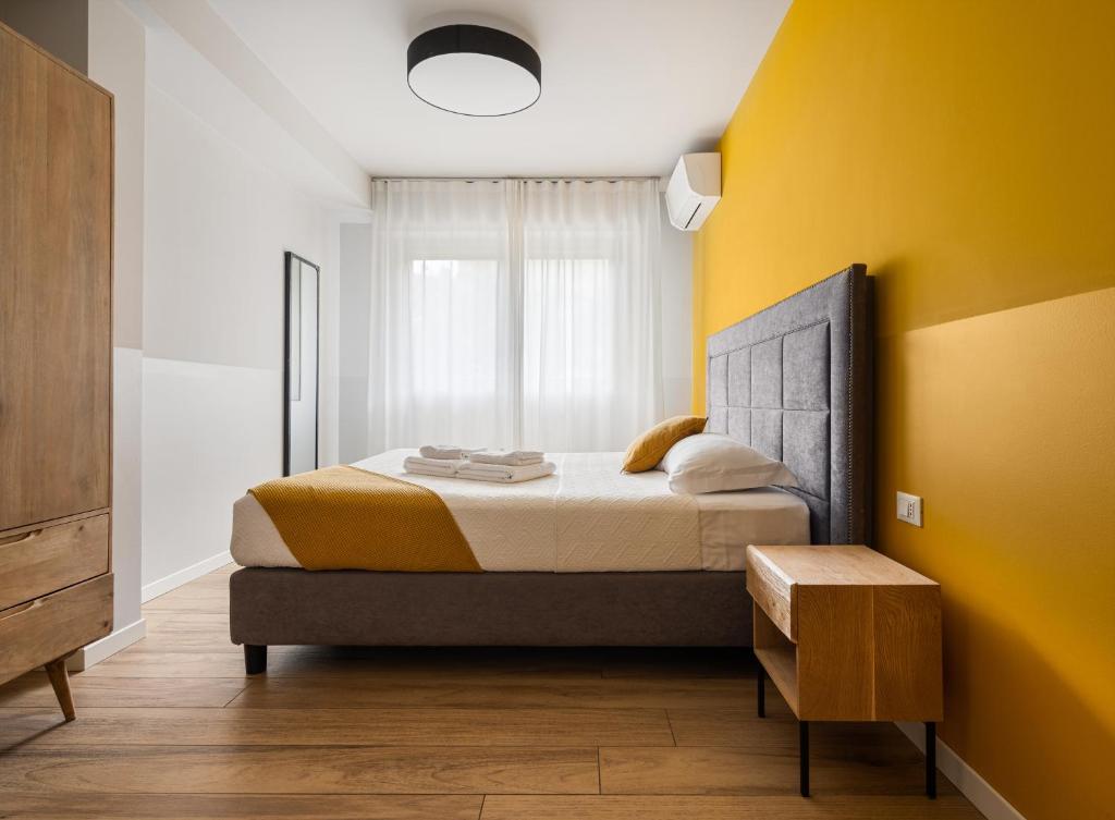 Postel nebo postele na pokoji v ubytování Donizetti Residence
