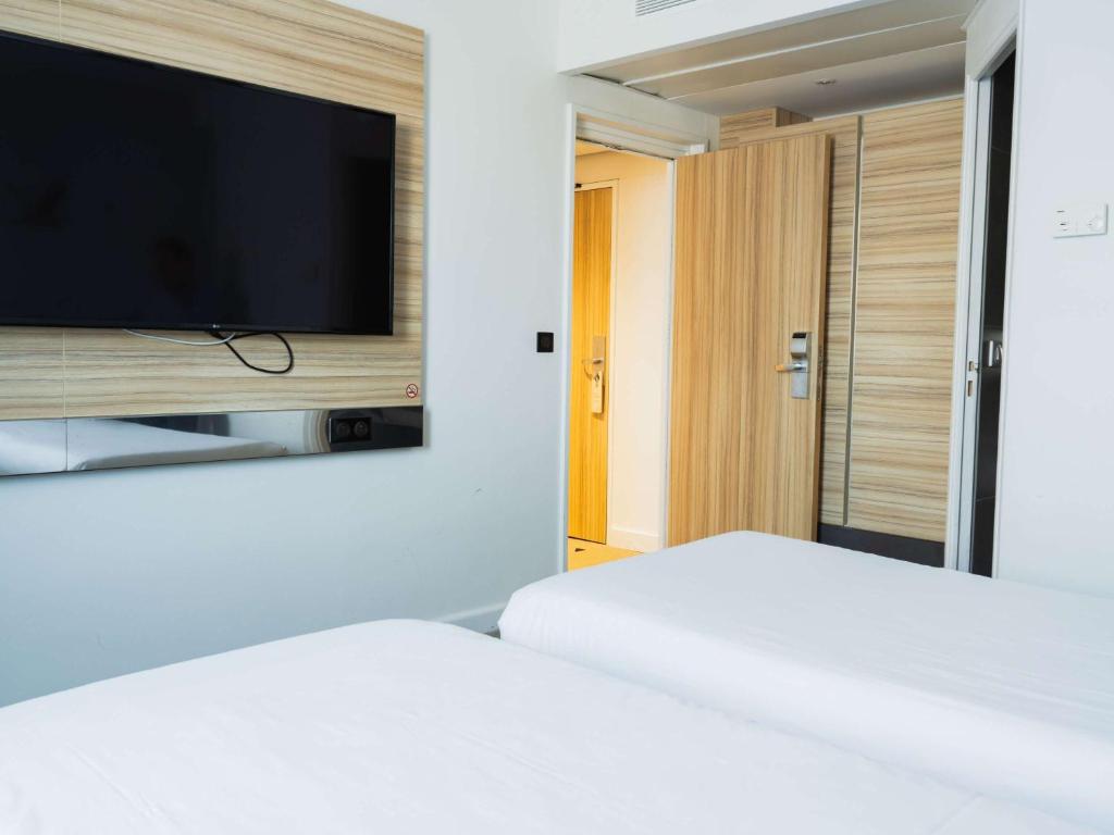 Postel nebo postele na pokoji v ubytování Novotel Valence Sud