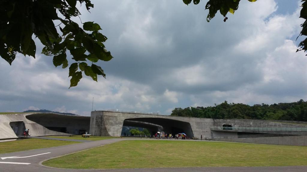 a large concrete building with a tunnel in it at Bestime B&amp;B in Jiji