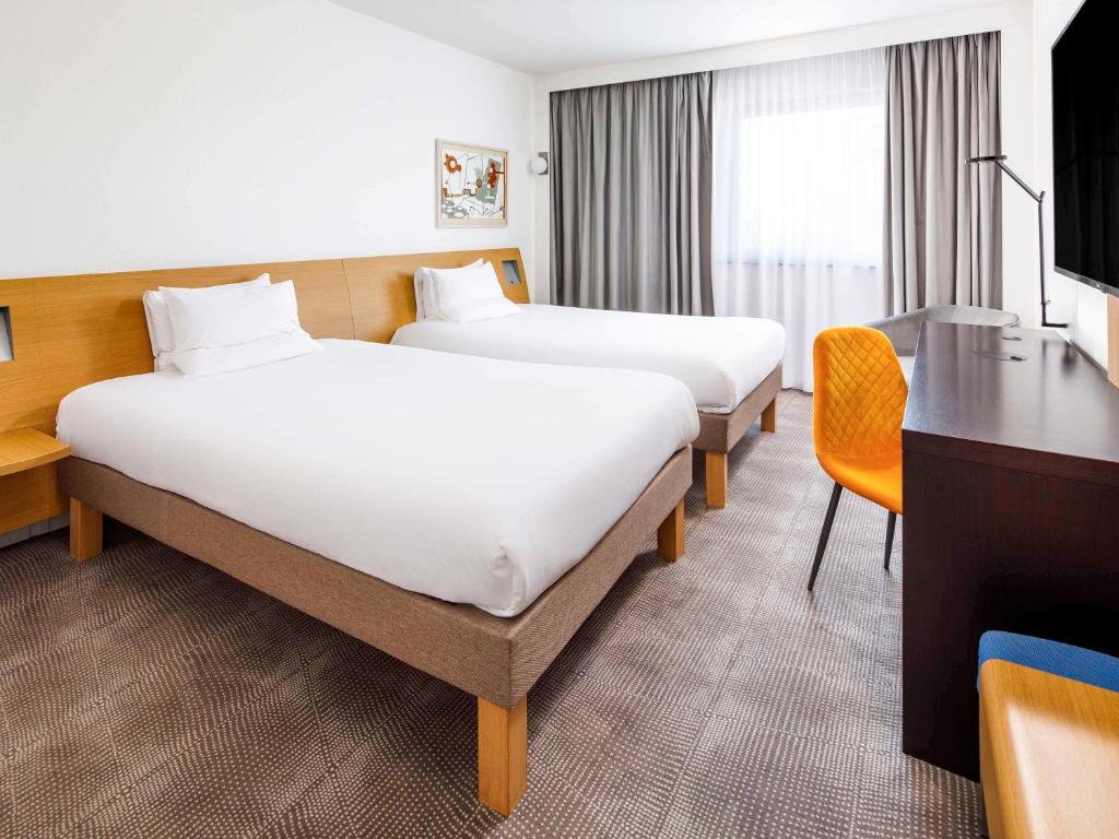 Postel nebo postele na pokoji v ubytování Novotel London Greenwich