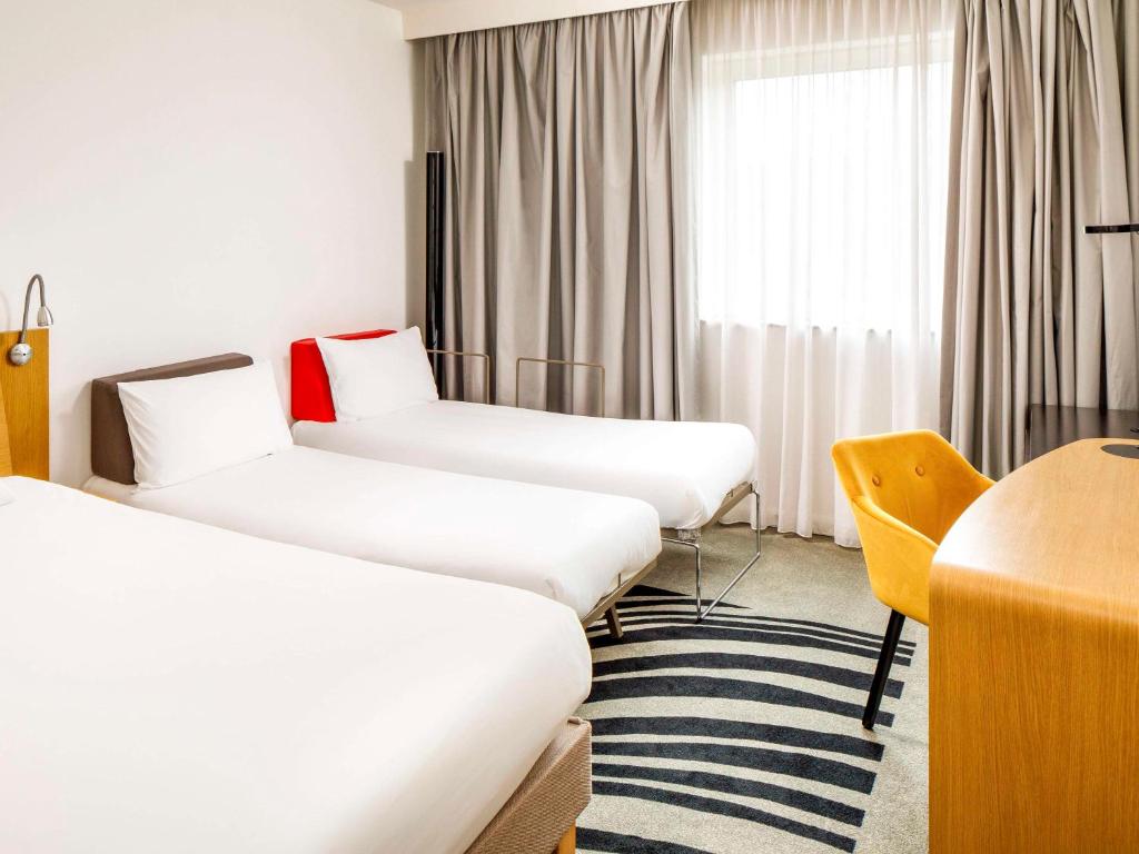 Postel nebo postele na pokoji v ubytování Novotel London Greenwich