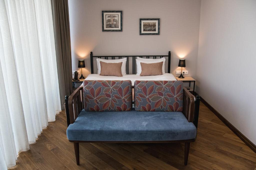 Postel nebo postele na pokoji v ubytování Makmani Boutique Hotel by DNT Group