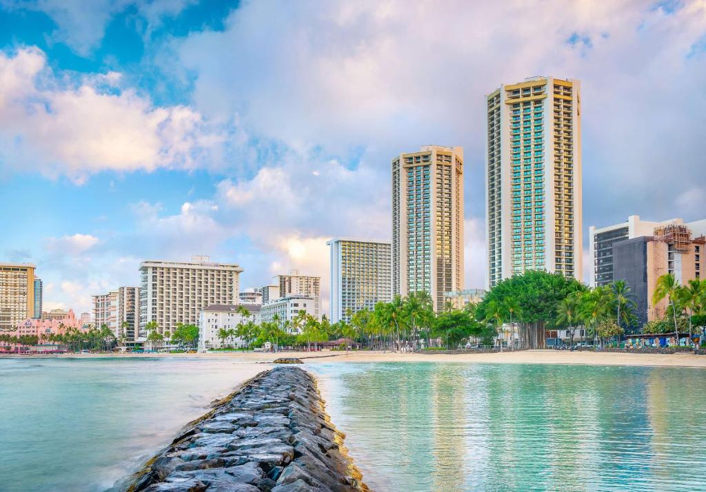 a city skyline with a beach and tall buildings at Hyatt Regency Waikiki Beach Resort & Spa in Honolulu