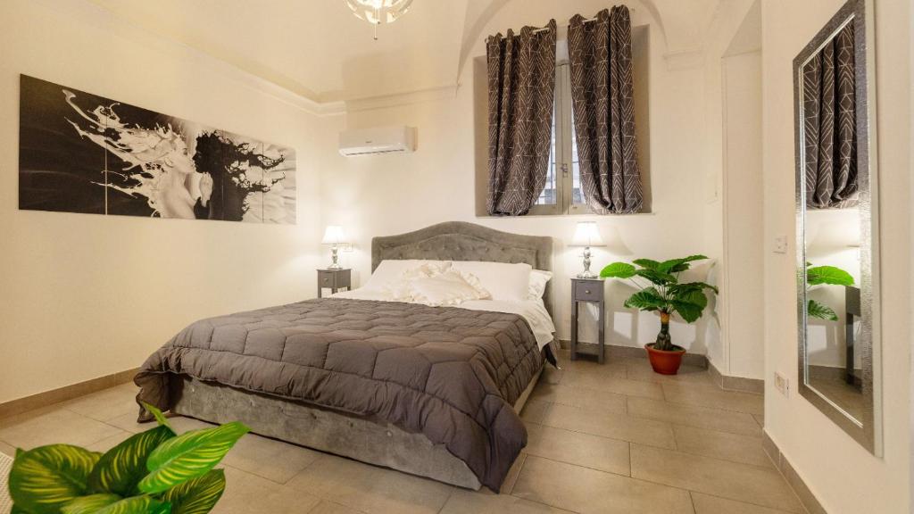 Кровать или кровати в номере Duomo Luxury Suite Catania