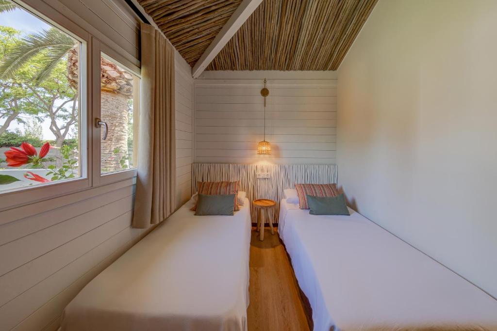 Postel nebo postele na pokoji v ubytování Sangulí Camping & Resort