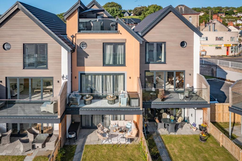 an aerial view of a house with a patio at Superb 3 Bed House Close To Snowdonia in Llansantffraid Glan Conwy