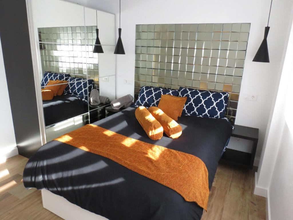 Ένα ή περισσότερα κρεβάτια σε δωμάτιο στο Apartamento AIRES DEL NORTE, con ASCENSOR y WiFi gratis