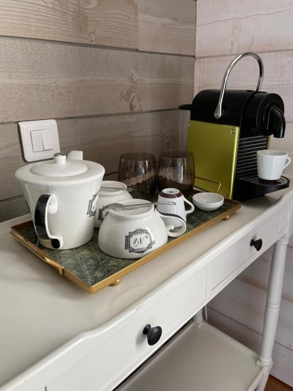 a tray with pots and pans on top of a counter at La Maison Bizienne Guérande in Guérande