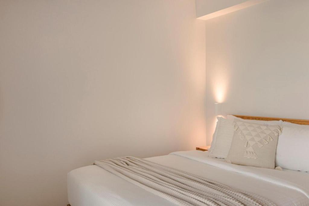 Łóżko lub łóżka w pokoju w obiekcie Nirvana - Unalome Villas