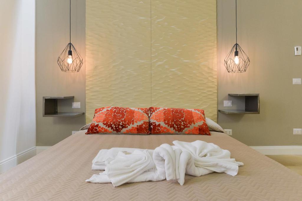 Łóżko lub łóżka w pokoju w obiekcie EVE Luxury Apartments Pantheon