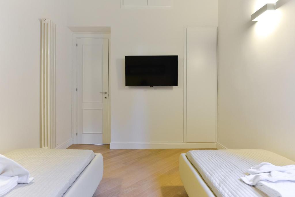 Telewizja i/lub zestaw kina domowego w obiekcie EVE Luxury Apartments Pantheon