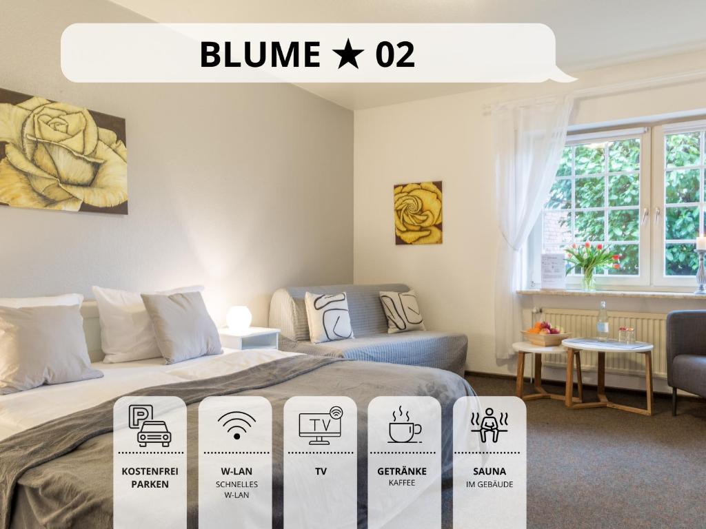 a room with a bed with signs on it at Blumenvilla 2 mit begehbarer Dusche, Sauna, Garten in Schneverdingen