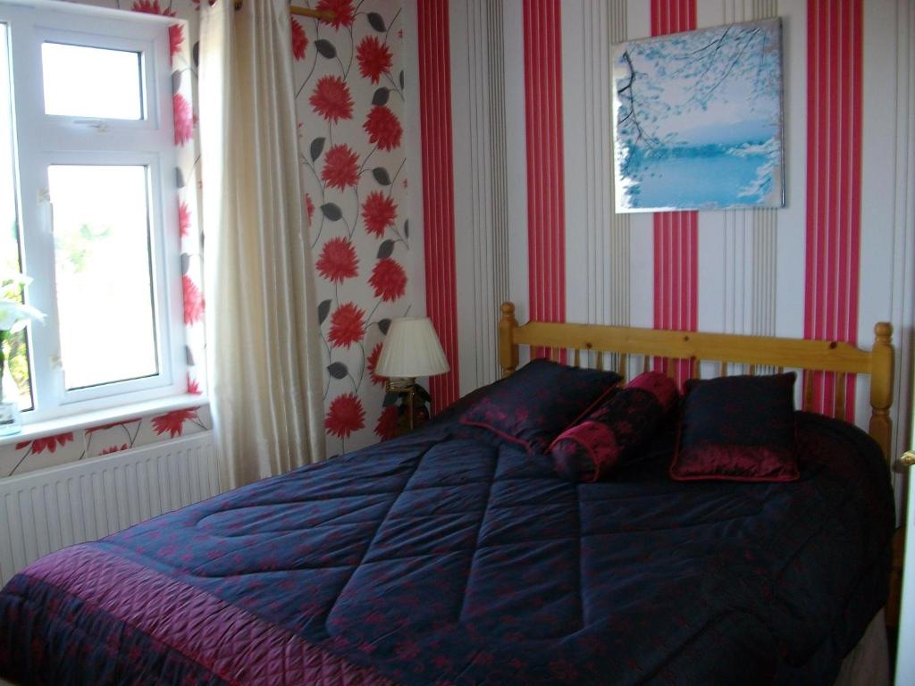 Postel nebo postele na pokoji v ubytování Clonmacnoise B&B