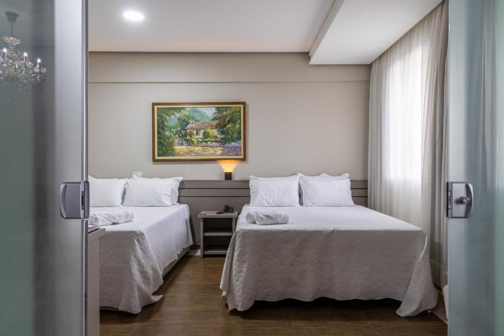 Postel nebo postele na pokoji v ubytování Hotel Dan Inn Uberlandia By Nacional Inn