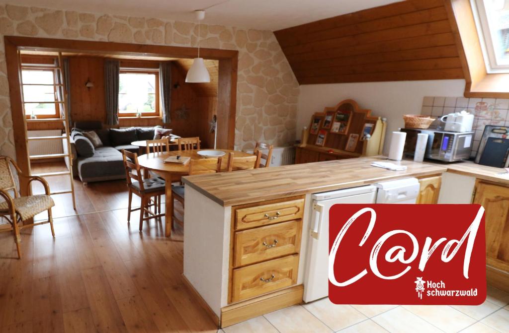 a kitchen and living room with a cocacola sign in the foreground at Ferienwohnung Seeblick Nr 3, 2 Zi-Bärental, Feldberg in Feldberg