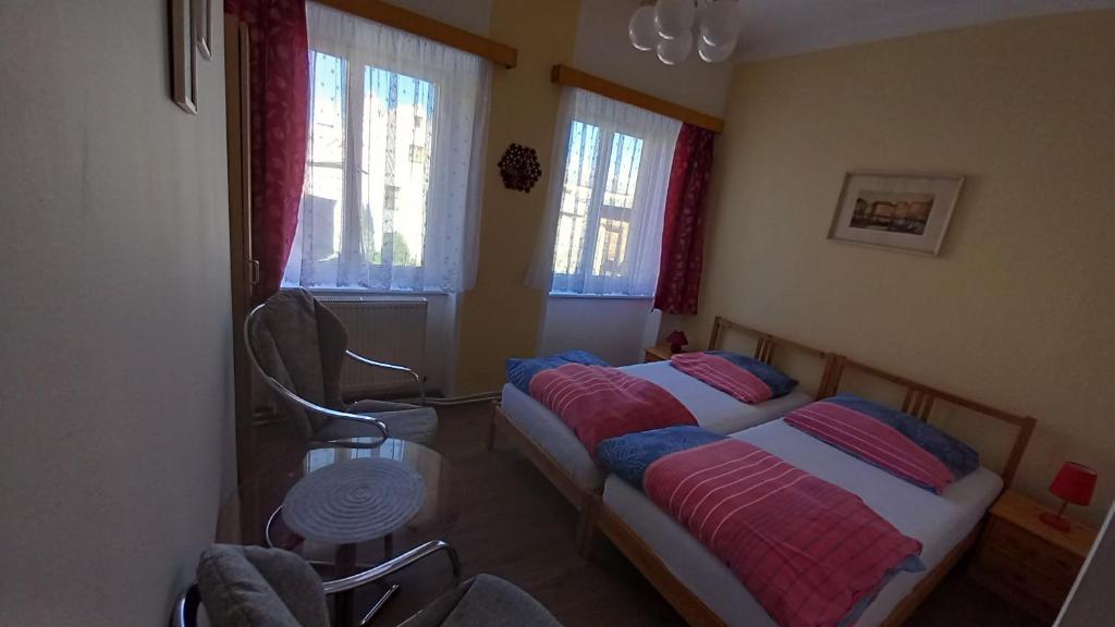 Postel nebo postele na pokoji v ubytování Apartman pod Zamkem