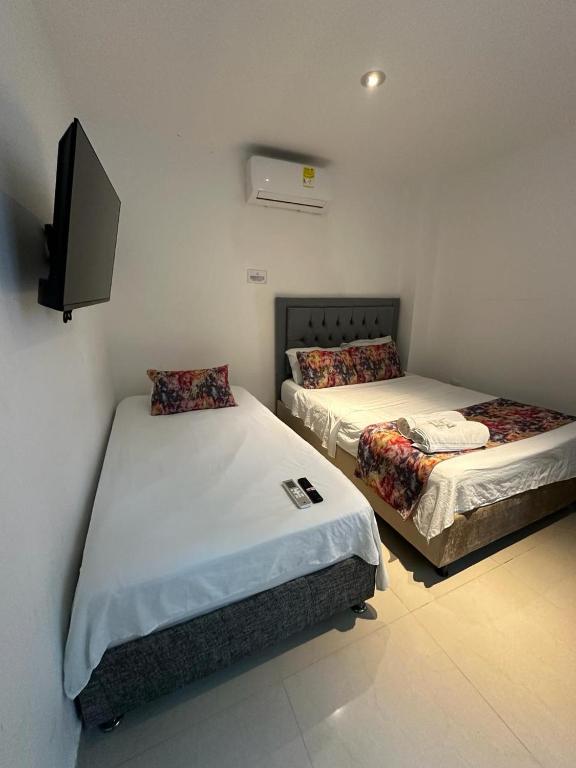 Postel nebo postele na pokoji v ubytování Hotel CastilloMar