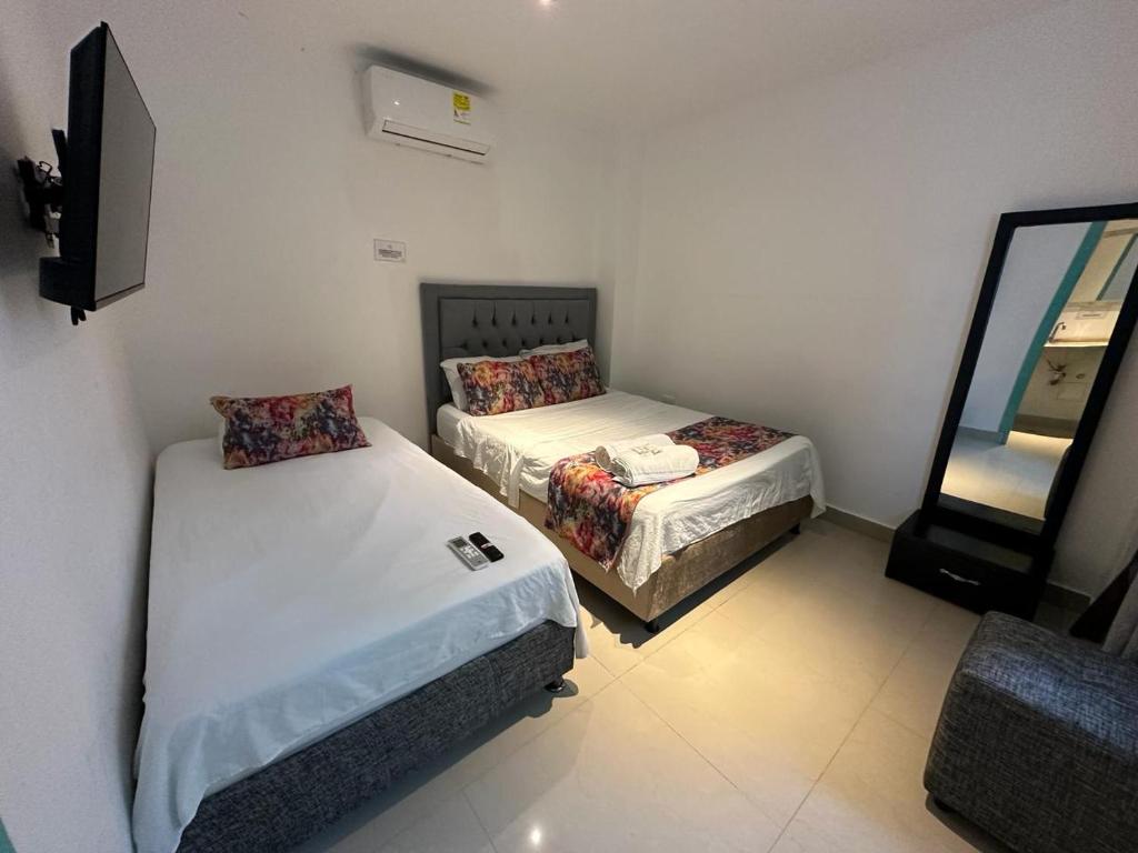 Postel nebo postele na pokoji v ubytování Hotel CastilloMar