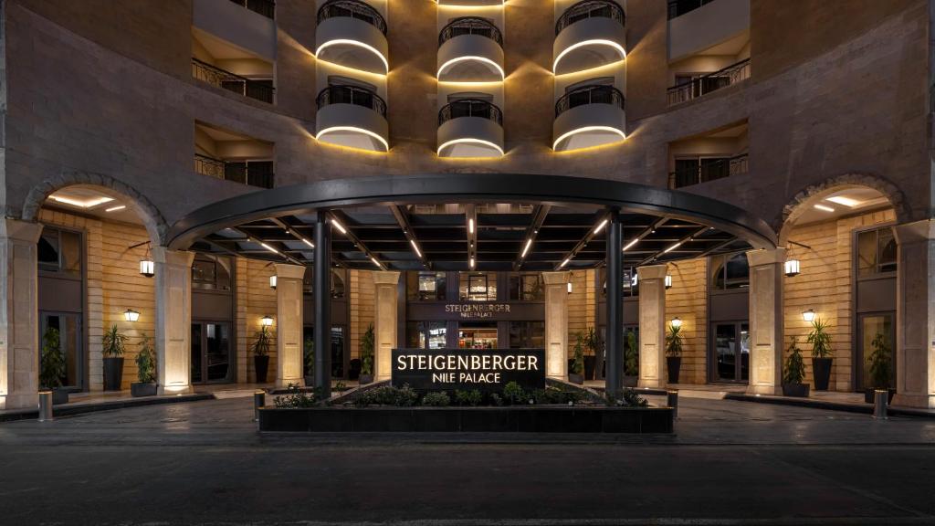 a large building with a sign in the middle at Steigenberger Nile Palace Luxor - Convention Center in Luxor