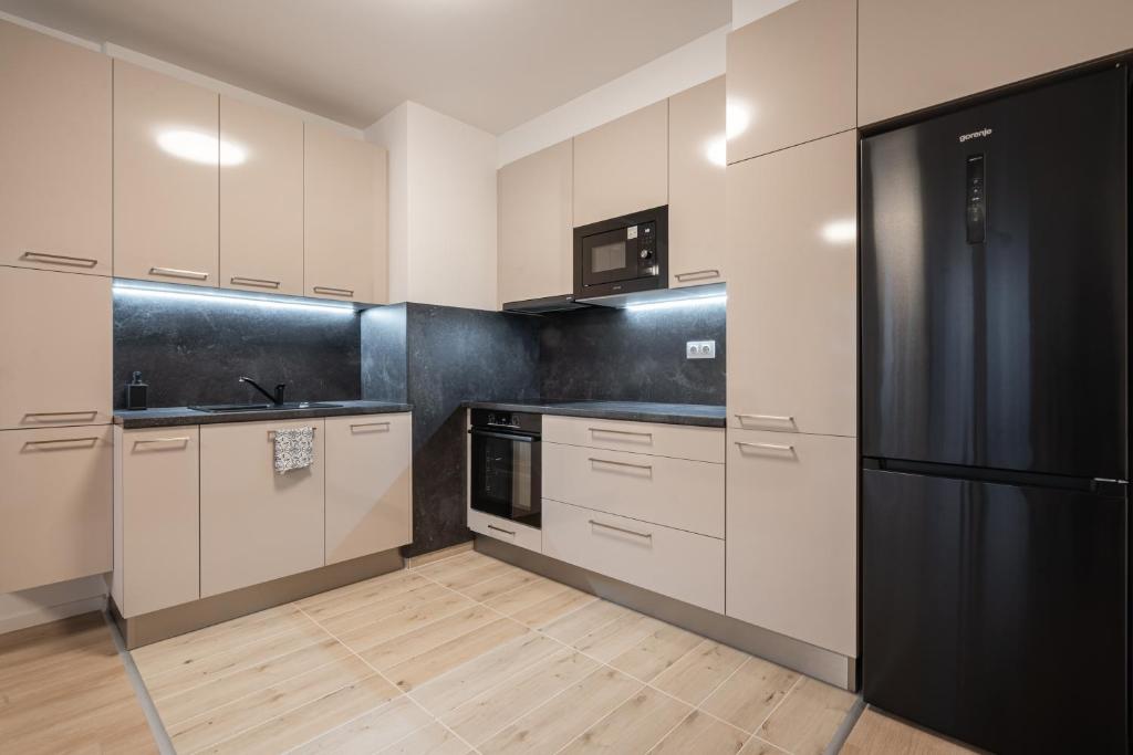 Kuchyňa alebo kuchynka v ubytovaní Szabolcs Apartments