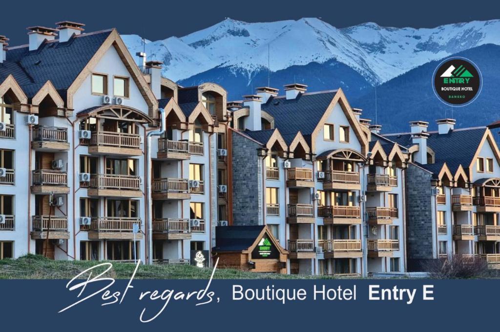 a picture of a hotel with mountains in the background at BOUTIQUE Hotel ENTRY E in Bansko