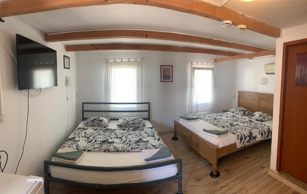 Postel nebo postele na pokoji v ubytování Bazart Vama Veche