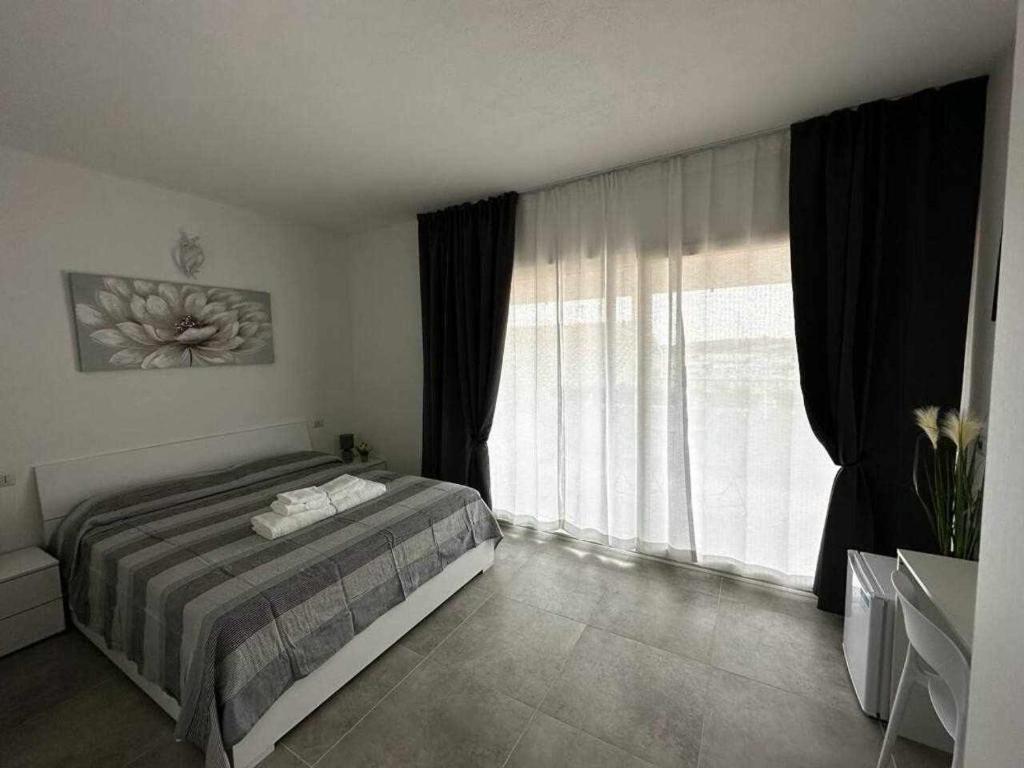 La Residenza del Re tesisinde bir odada yatak veya yataklar
