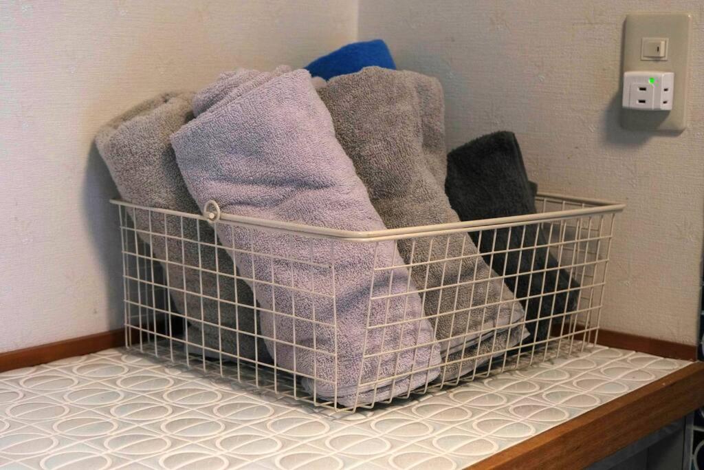 Postel nebo postele na pokoji v ubytování ワタリグラスハウス