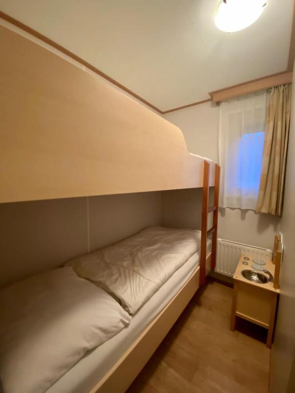 Postel nebo postele na pokoji v ubytování Chalet Seazon R23