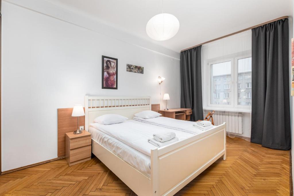 Posteľ alebo postele v izbe v ubytovaní Apartamenty Wawa Centrum by Your Freedom