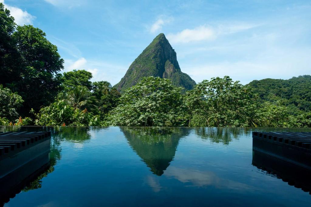 a view of a river with a mountain in the background at Rabot Hotel From Hotel Chocolat in Soufrière